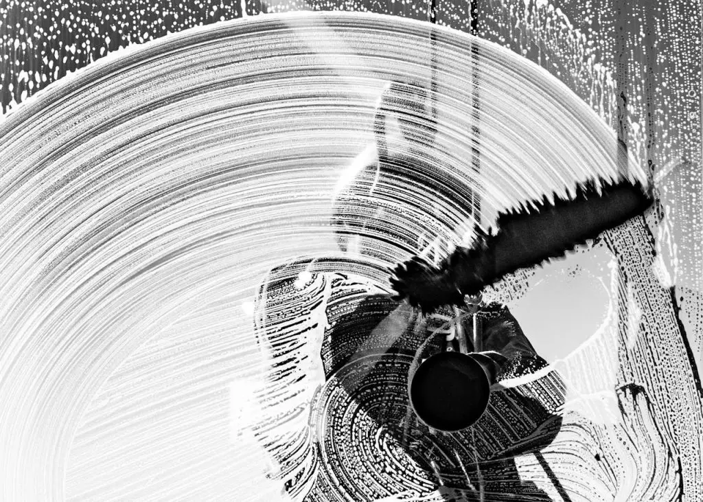 Artistic abstract image of a worker cleaning a window in Buenos Aires.