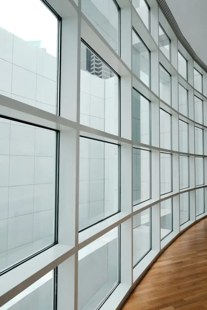 Curved glass panel architecture showcasing modern design and natural light in Atlanta.